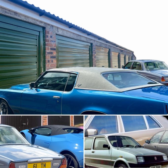 many cars next to a lock up garage