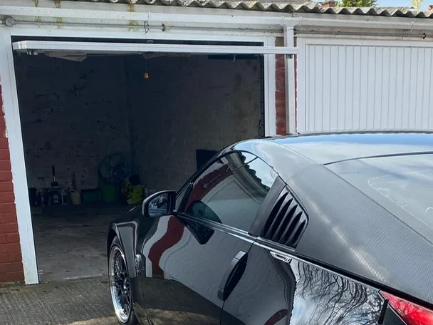 A lock up garage with door open