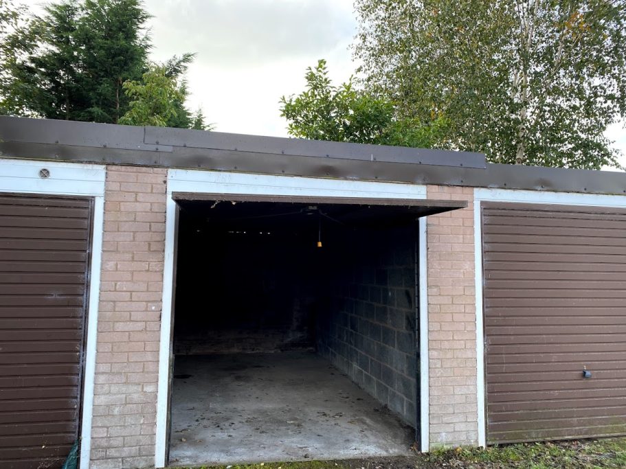 a single lock up garage showing the interior