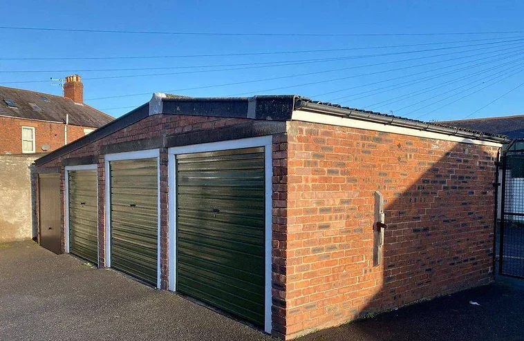 a row of four lock up garages