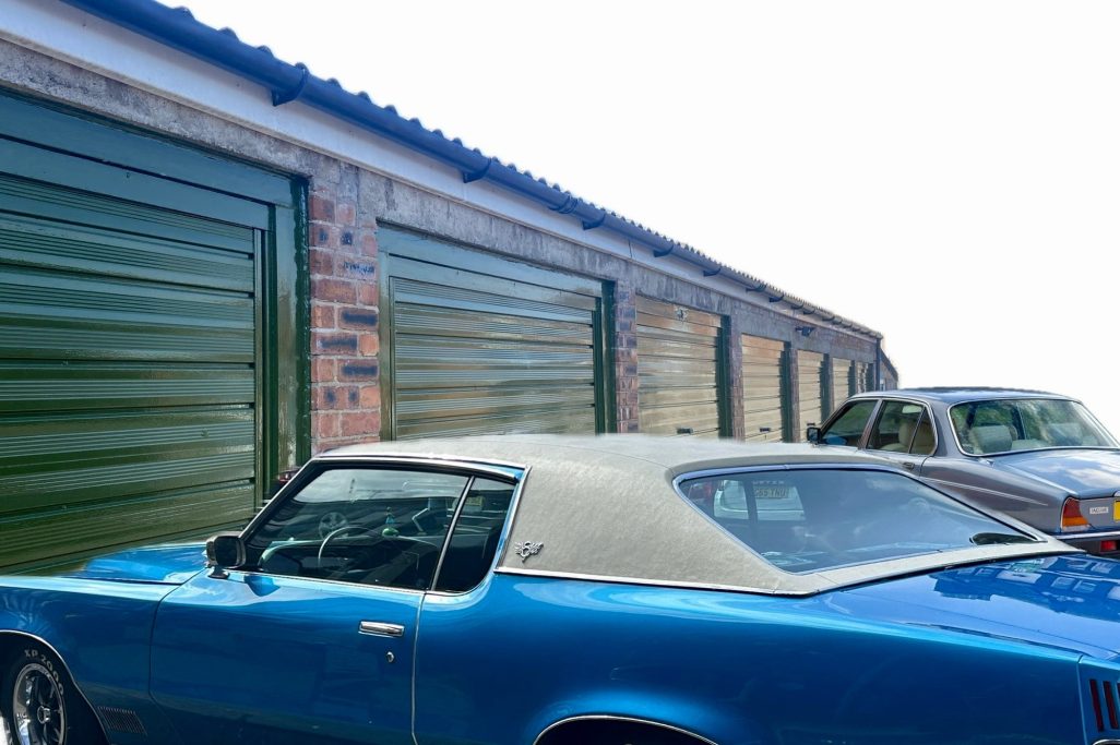 a car being about to be stored in a garage