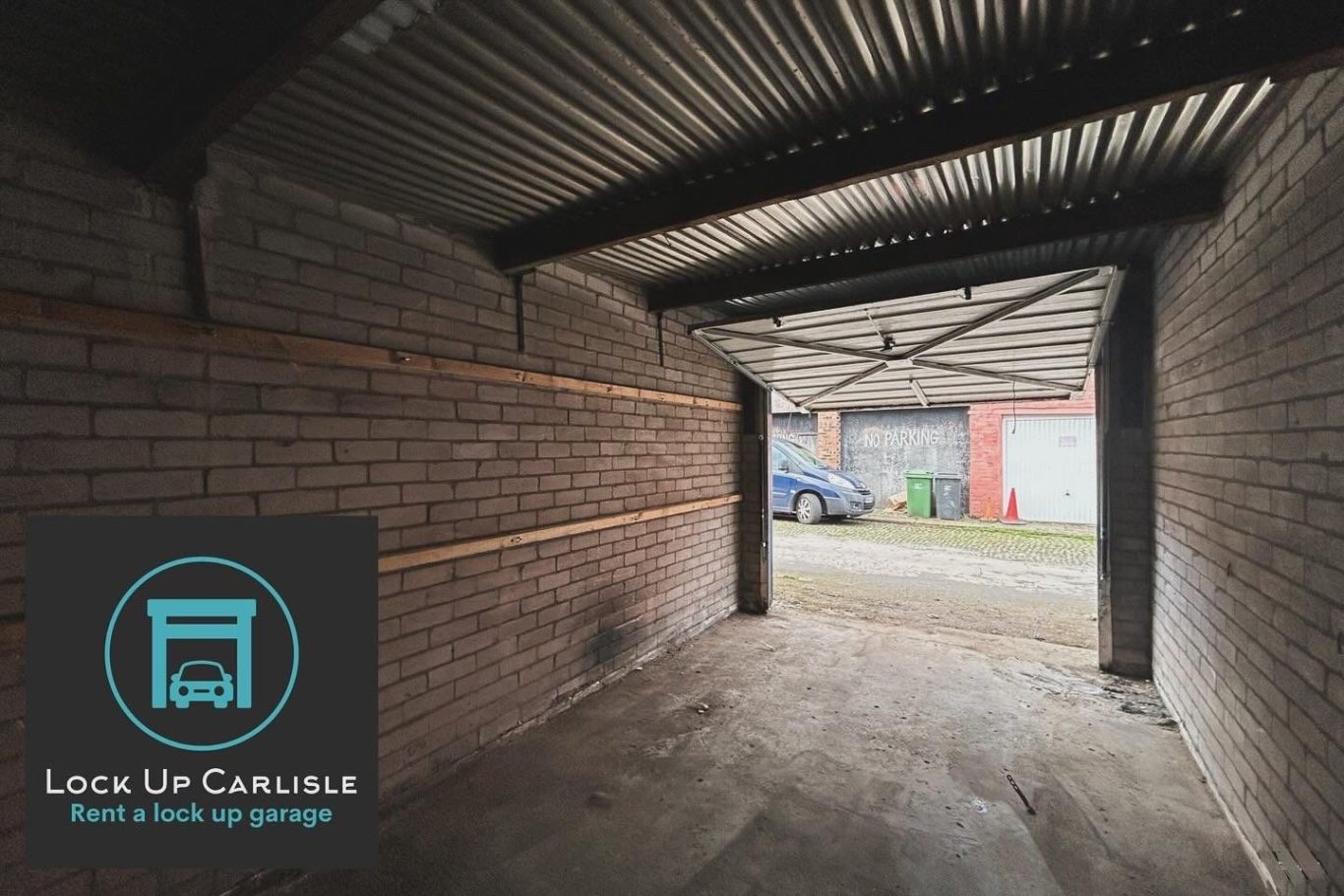 the interior of a lock up garage showing an up and over door