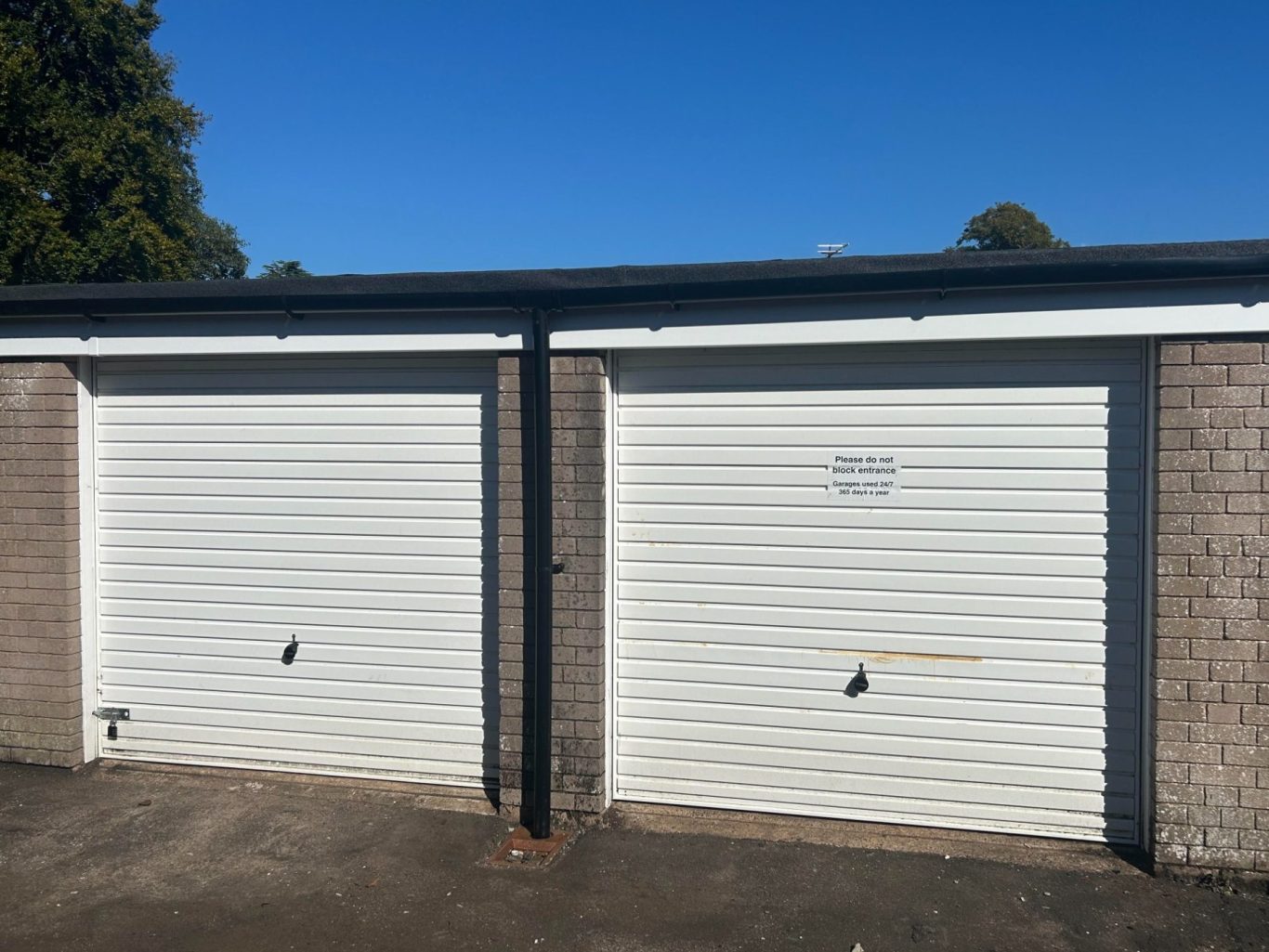 a pair of lock up garages with metal doors