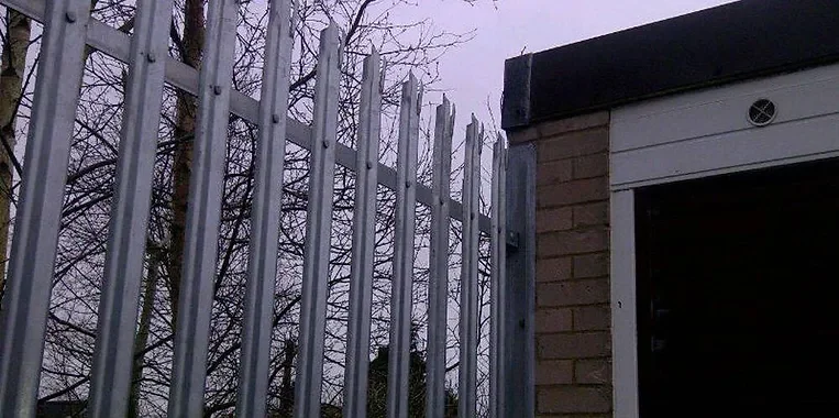 security fencing next to a lock up garage