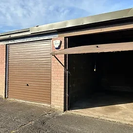 a lock up garage with an up and over style door