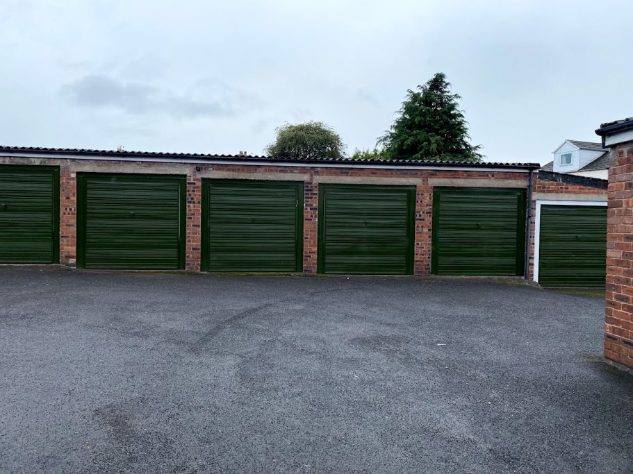 a row of green lock up garages