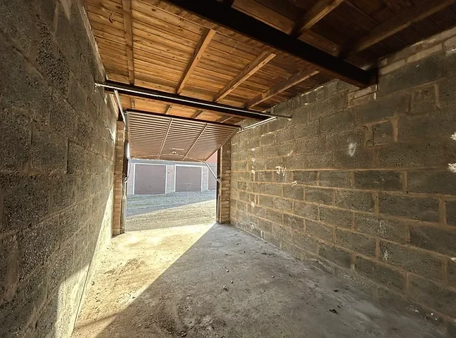 the inside of a lock up garage for sale